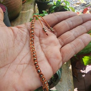 Macramé Rust with golden beads Caterpillar pattern